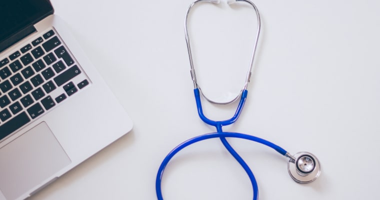 stethoscope and laptop