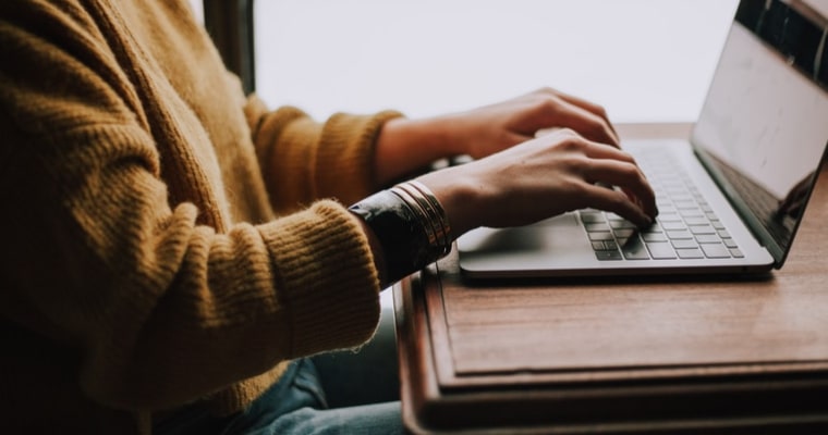 typing on laptop