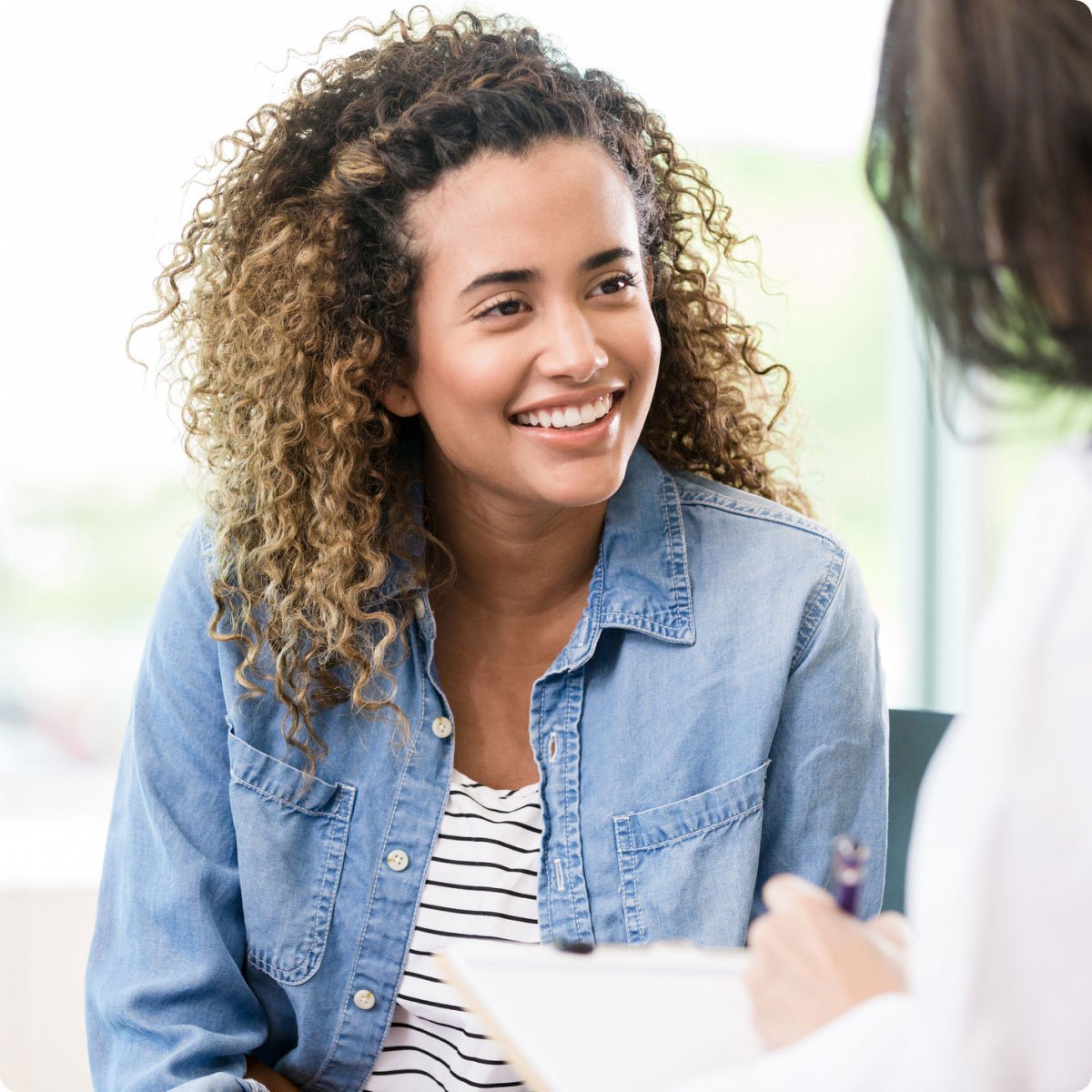 counseling patient smiling with therapist