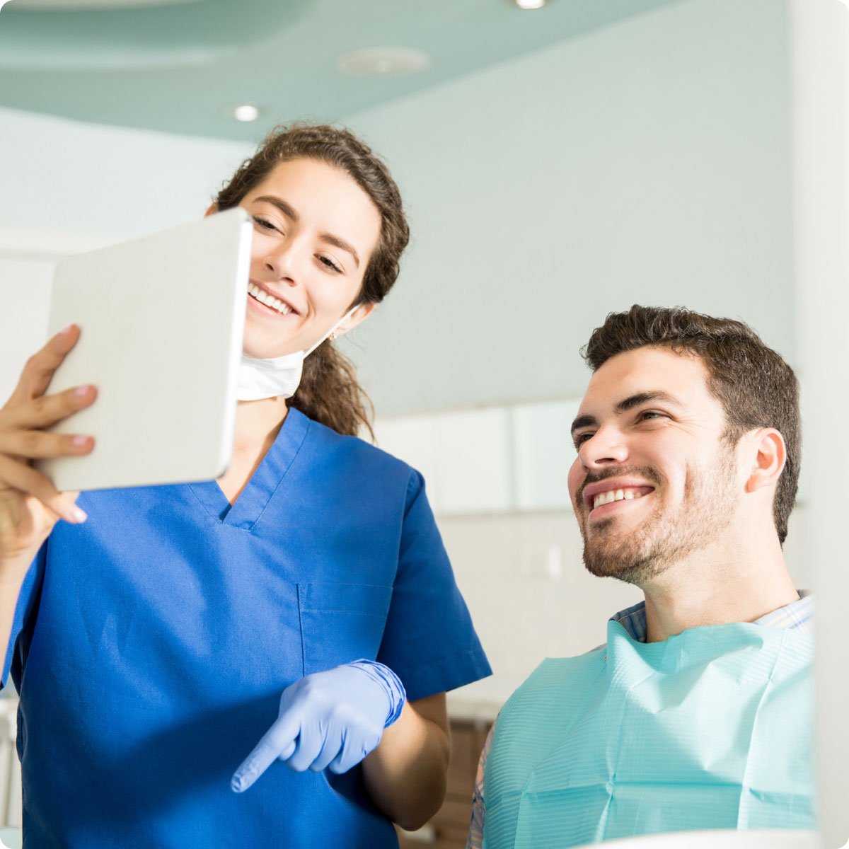 dentist with patient smiling