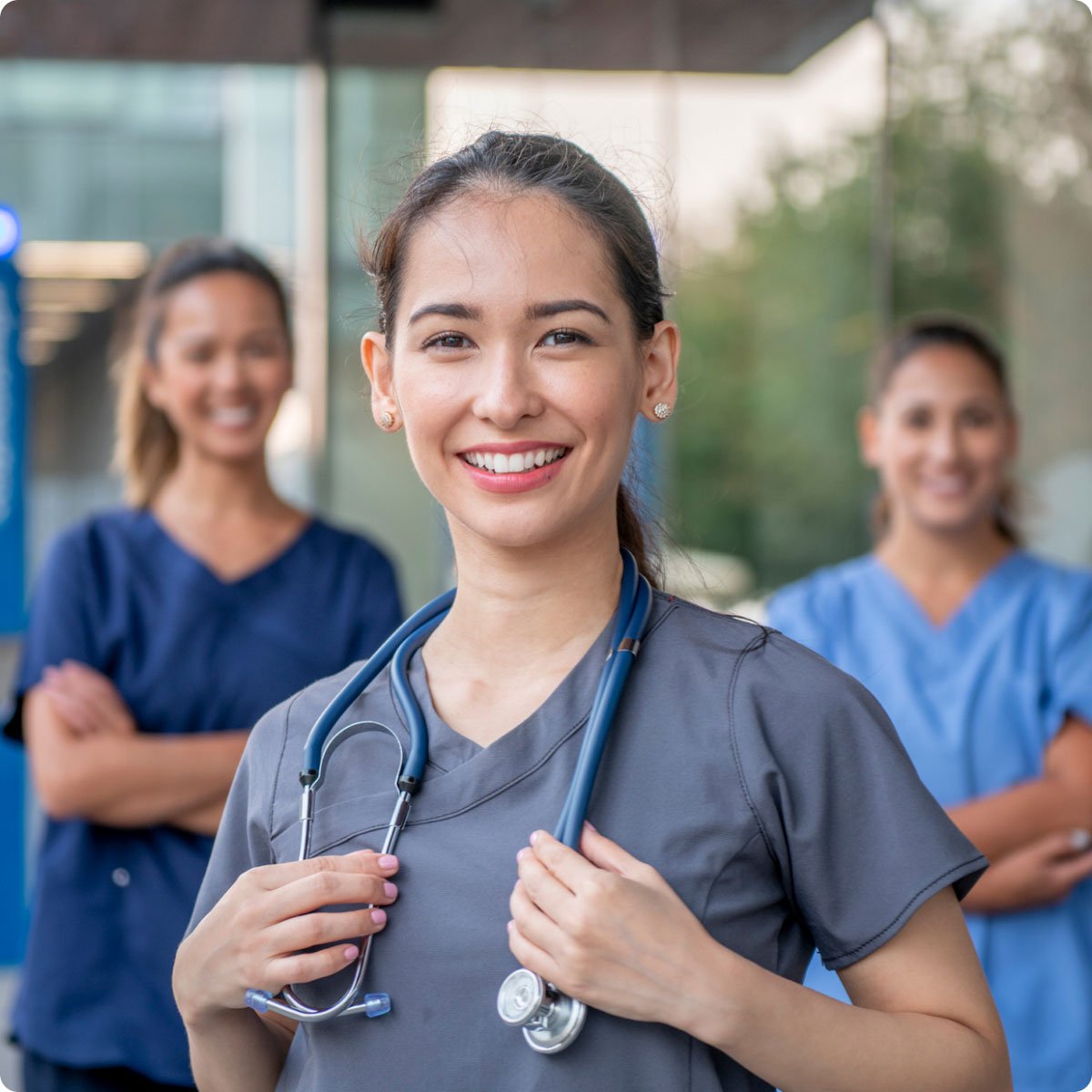 nurses smiling standing together