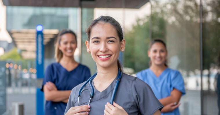 nurses standing together smiling