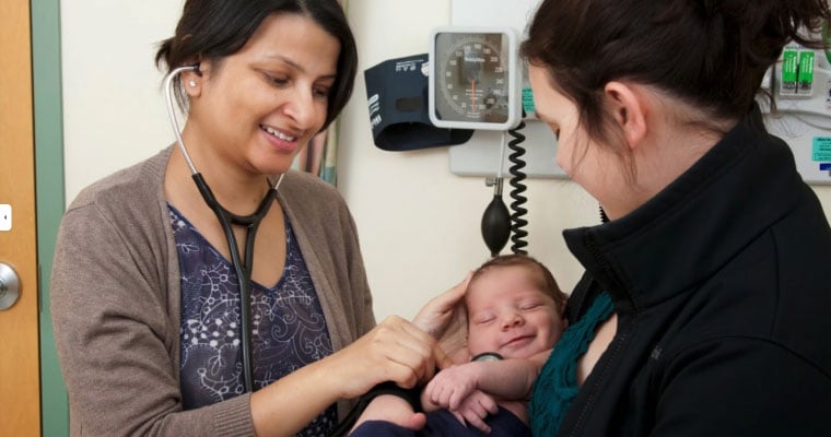 doctor with mother and child